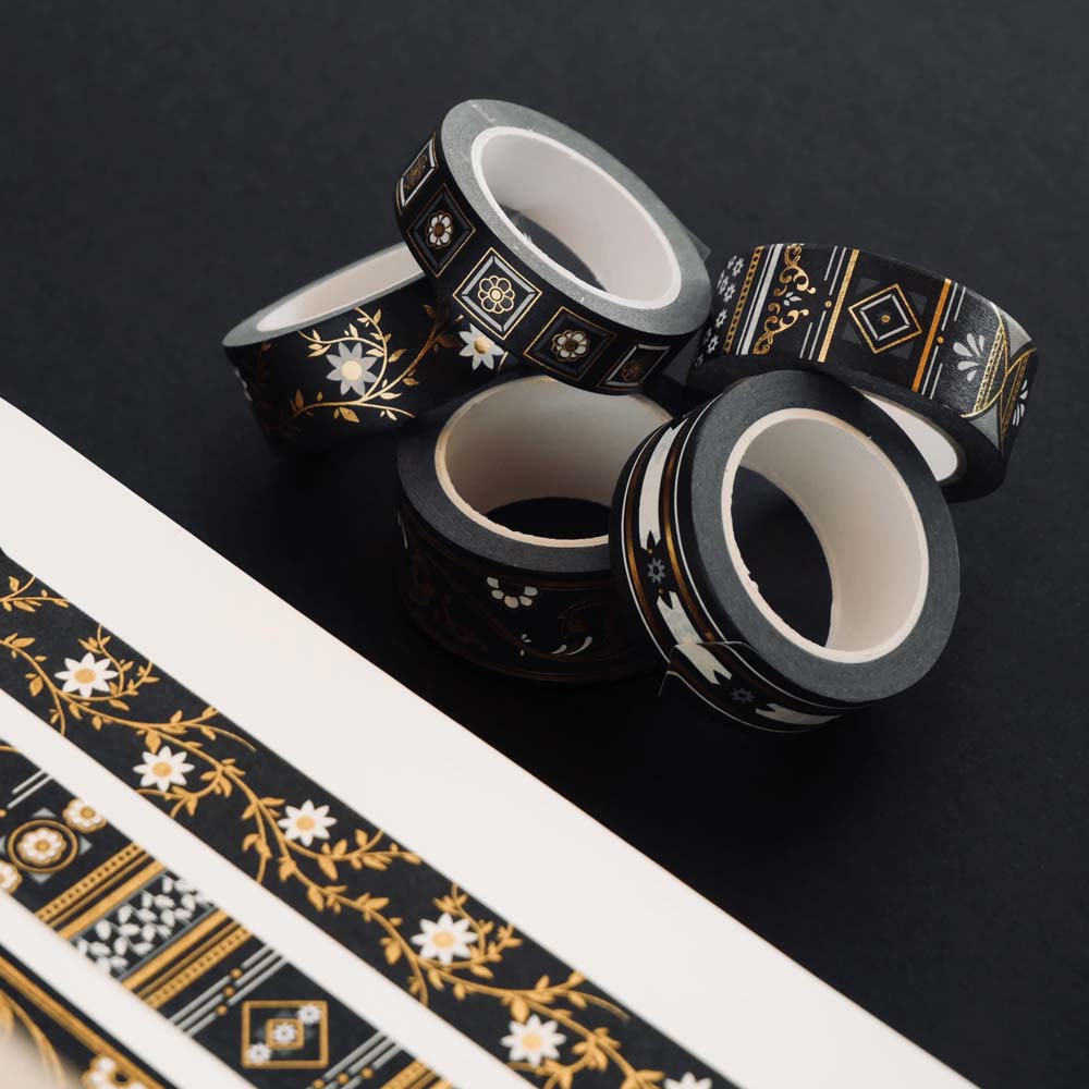 Washi tapes with a black background, white and gold flowers and gold foil