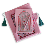 The Sugar & Spice journal bundle includes a Lust & Longing Journal, bookmark, pen and book sleeve. All items are a light pink colour and feature intricate red, light pastel green and white detailing of romantic floral imagery. The Book sleeve features detailed embroidery and both the sleeve and bookmark feature a light mint green tassle.