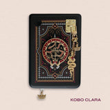Decorated Kobo Libra with a set of aesthetic ereader accessories. Theme is dark fantasy and includes snakes, swords, crowns and dragon eyes. Colours are black, red, white and gold. 