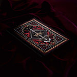 Decorative dark fantasy journal with intricate designs on a dark fabric background