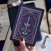 Decorative dark and moody kindle sticker against a dark background e reader