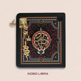 Decorated Kobo Libra with a set of aesthetic ereader accessories. Theme is dark fantasy and includes snakes, swords, crowns and dragon eyes. Colours are black, red, white and gold. 