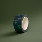 The Sage green variation of the Ornate Literati washi tape. The book inspired washi tape design is shown on a green green background and features a ornate wall paper inspired design in shades of dark green, sage green and gold.
