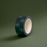 The Sage green variation of the Ornate Literati washi tape. The book inspired washi tape design is shown on a green green background and features a ornate wall paper inspired design in shades of dark green, sage green and gold.