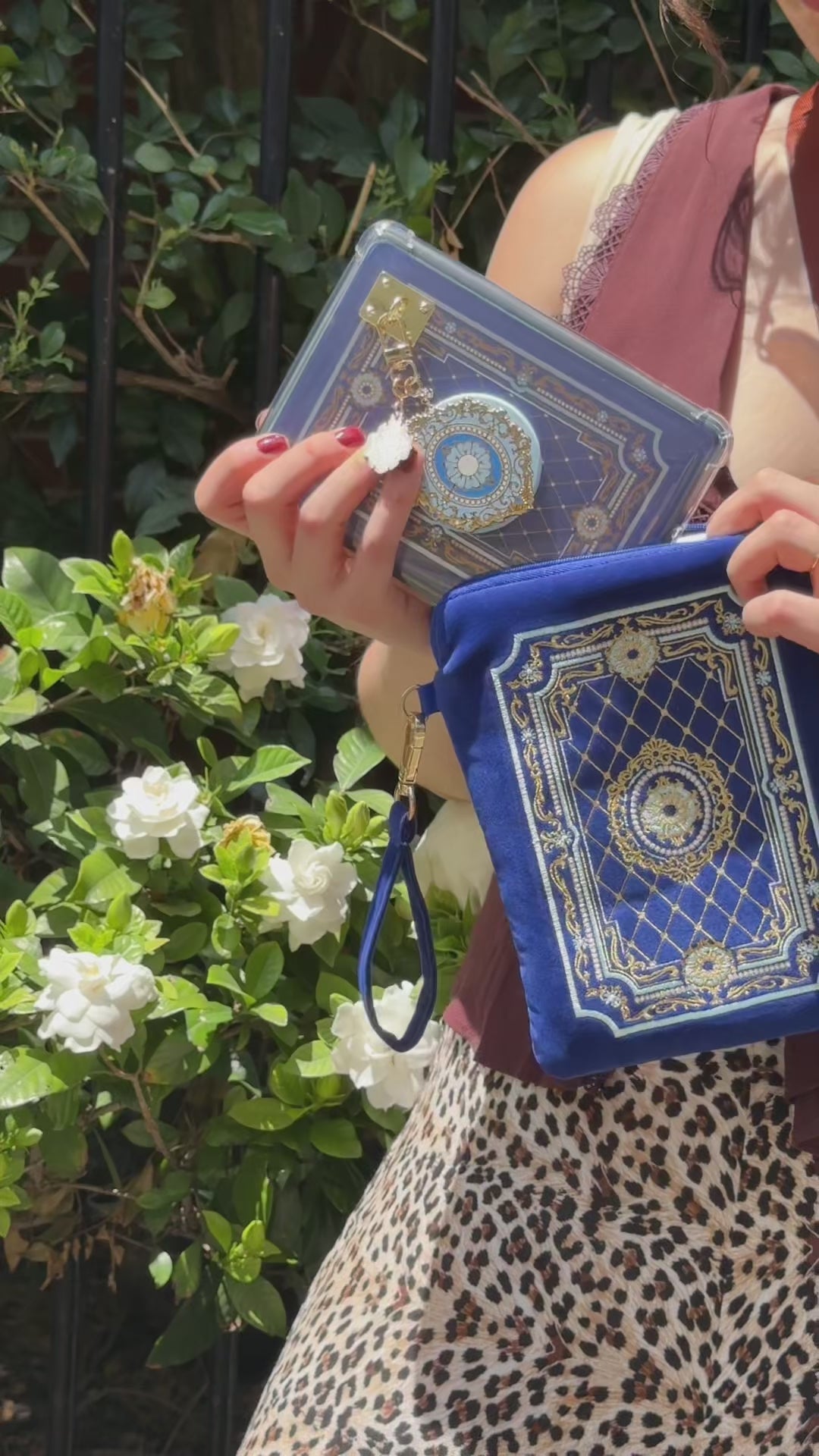 A video showing the Moncherie e-reader bundle (aka a kindle decor set) by The Quirky Cup Collective in use. The embroidered kindle case, kindle insert sticker, charmlet (attached with a charm anchor) and kindle pop socket (aka a clingie) feature a french aesthetic with royal blue backgrounds with light blue and gold detailing.