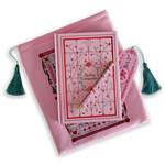 The Sugar & Spice journal bundle includes a Reading Companion Journal, bookmark, pen and book sleeve. All items are a light pink colour and feature intricate red, light pastel green and white detailing of romantic floral imagery. The Book sleeve features detailed embroidery and both the sleeve and bookmark feature a light mint green tassle.