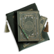 The sage green reading journal bundle from the classic book inspired Literati collection. This soft green variation includes a book sleeve, reading journal, pen and bookmark from the collection. All share a slightly Victorian book inspired motif in shades of gold, white and green . The foiled reading journal, pen and bookmark feature intricate gold foiling while the velvet book sleeve is embroidered. The sleeve and bookmark also feature gold and soft green tassels.