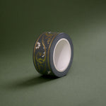 The Sage green variation of the Scriptus Literati washi tape. The classic book inspired washi tape design is shown on a green background and features a classic victorian motif of flowers and curling scrolls in shades of dark green, sage green, white and foiled gold.