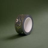 The Sage green variation of the Scriptus Literati washi tape. The classic book inspired washi tape design is shown on a green background and features a classic victorian motif of flowers and curling scrolls in shades of dark green, sage green, white and foiled gold.