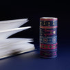 The full set of Serpents and Swords washi tapes, a dark fantasy book inspired collection by The Quirky Cup Collective, are stacked in front of a blue backround. The five washi tapes are in shades of blue, pink and white with intricate gold foiling. The designs feature motifs of snakes, crowns, swords, goblets , stars and serpents and perfectly match the romantasy book aesthetic.