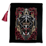 Hand holding a black book sleeve with decorative fantasy embroidery with red background book sleeve