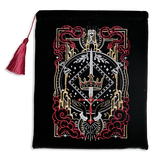 Hand holding a black book sleeve with decorative fantasy embroidery with red background book sleeve