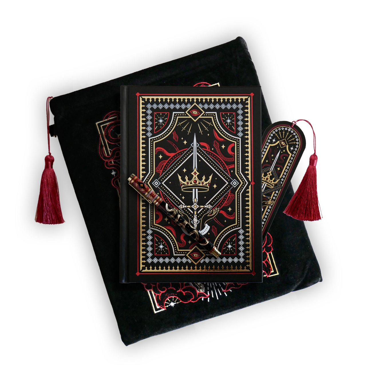 The journal bundle from the Serpents & Swords collection. This black variation includes a book sleeve, journal, pen and bookmark from the collection. All feature a design with motifs of crowns swords and snakes in shades of white, red and gold. The journal, pen and bookmark feature gold foiling while the velvet book sleeve is embroidered. The sleeve and bookmark also feature red tassels.