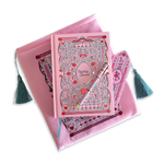 The Sugar & Spice journal bundle includes a Reading Journal, bookmark, pen and book sleeve. All items are a light pink colour and feature intricate red, light pastel green and white detailing of romantic floral imagery. The Book sleeve features detailed embroidery and both the sleeve and bookmark feature a light mint green tassle.