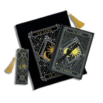 bundle of black stationery items on a plain background. Items are a book sleeve, journal, pen and bookmark. Design features a moon and sun caressed by hands with celestial inspired design. 
