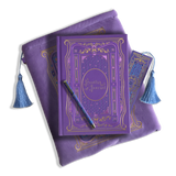 The wisteria reading journal bundle from the classic book inspired Literati collection. This soft lilac variation includes a book sleeve, reading journal, pen and bookmark from the collection. All share a slightly Victorian book inspired motif in shades of gold, pink, purple and blue. The foiled reading journal, pen and bookmark feature intricate gold foiling while the velvet book sleeve is embroidered. The sleeve and bookmark also feature light blue tassels.