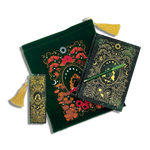 bundle of green stationery items on a plain background. Items are a book sleeve, journal, pen and bookmark. Design features a girl sitting on a mushroom surrounded by an ornate frame and botanicals decorations. 