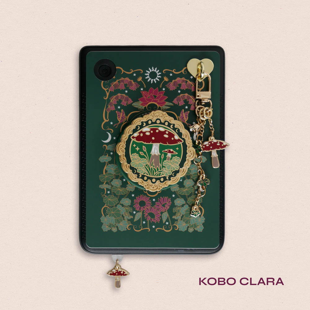 Decorated Kobo Clara with a set of aesthetic ereader accessories. Theme is cottage core and includes a toadstool mushroom, lily of the valley, nasturtium, butterflies, dandelions, moons and stars. Colours are green, red, white and gold. 