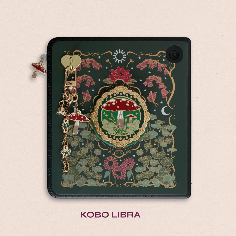 Decorated Kobo Libra with a set of aesthetic ereader accessories. Theme is cottage core and includes a toadstool mushroom, lily of the valley, nasturtium, butterflies, dandelions, moons and stars. Colours are green, red, white and gold. 