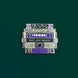 An enamel pin of a decorative book stack design (in shades of purple, green, and gold) with various spine designs including one that reads 'YOU ARE MAGIC' sits on a green background.