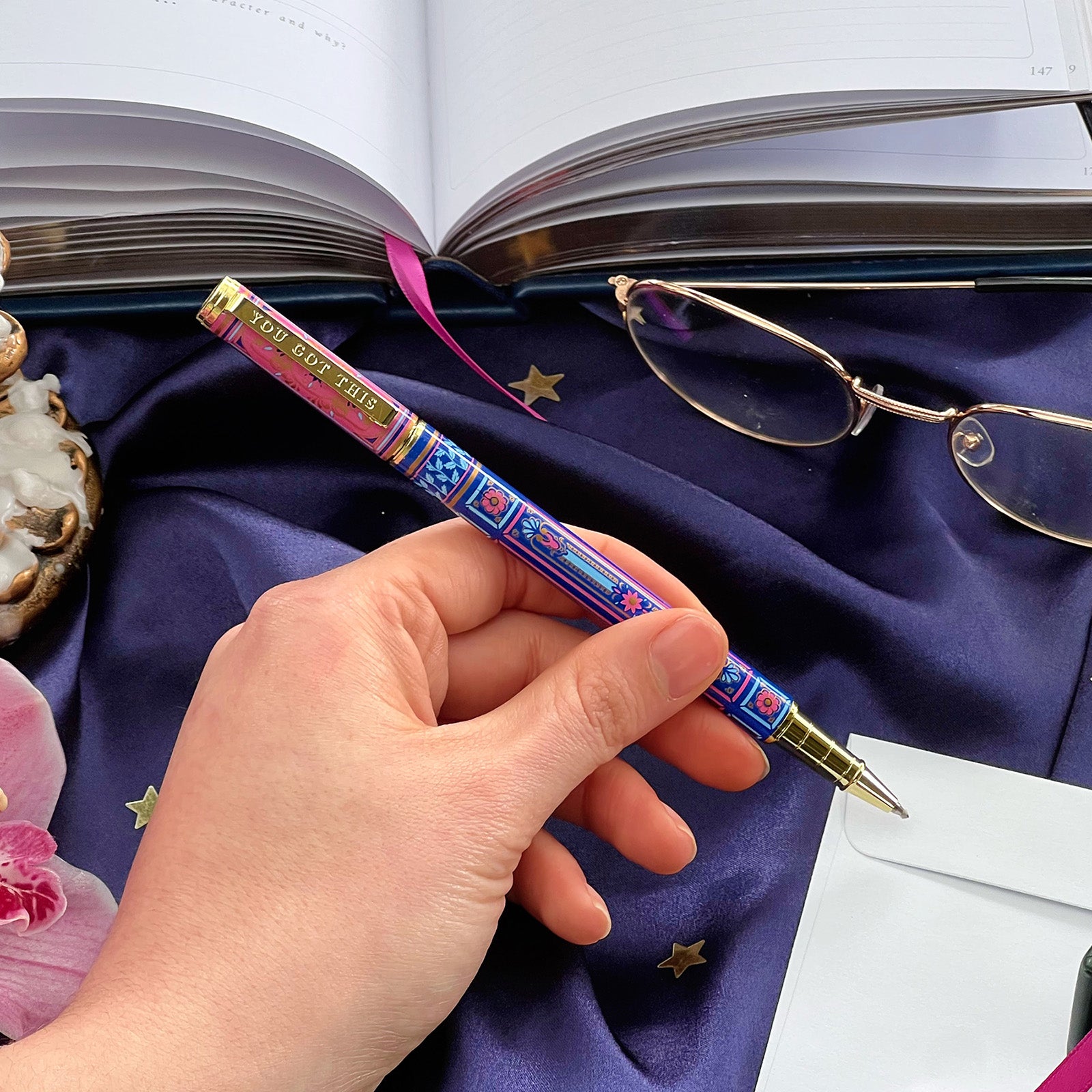 You got this gel pen- black ink- reading journal pen - blue and pink - the quirky cup collective