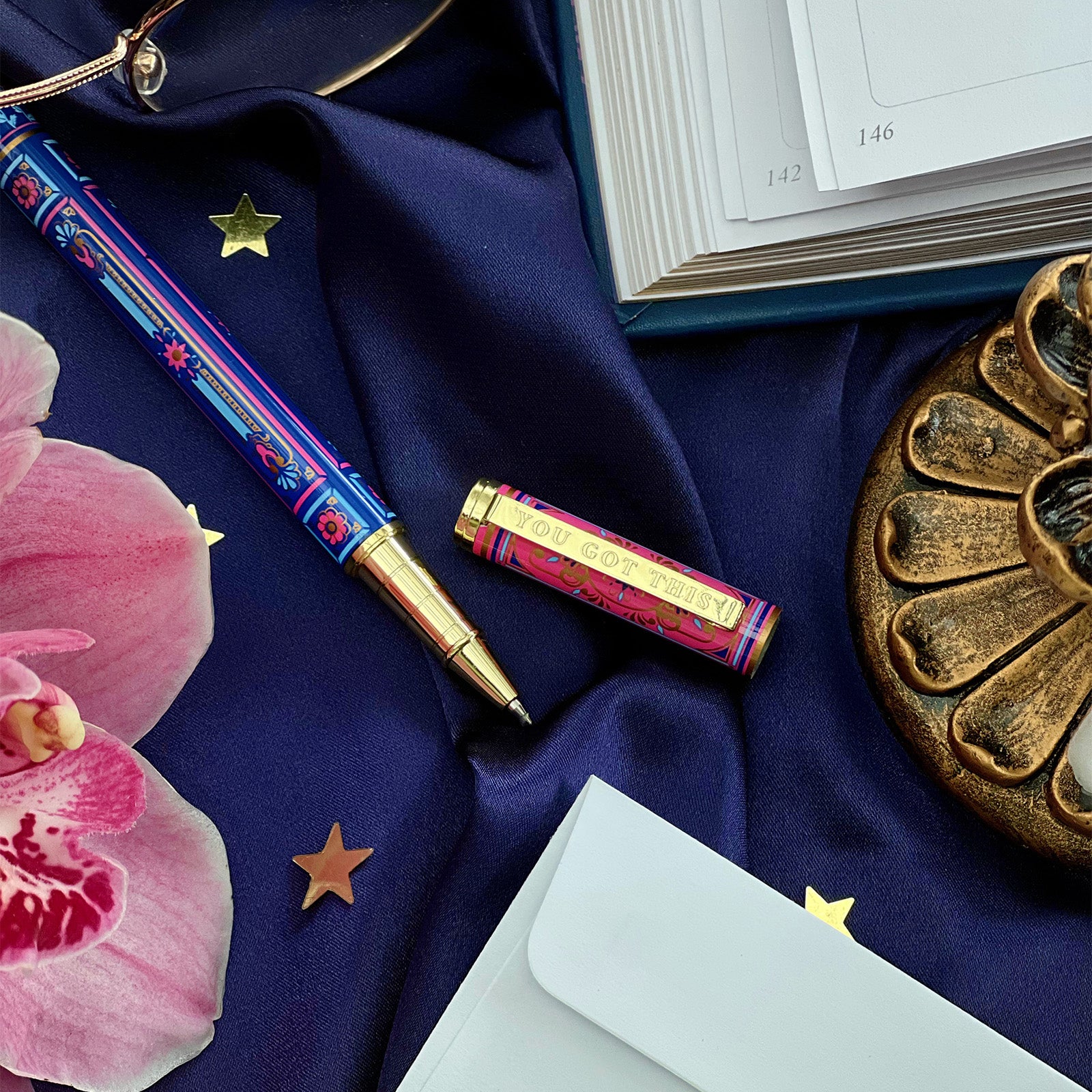 You got this gel pen- black ink- reading journal pen - blue and pink - the quirky cup collective