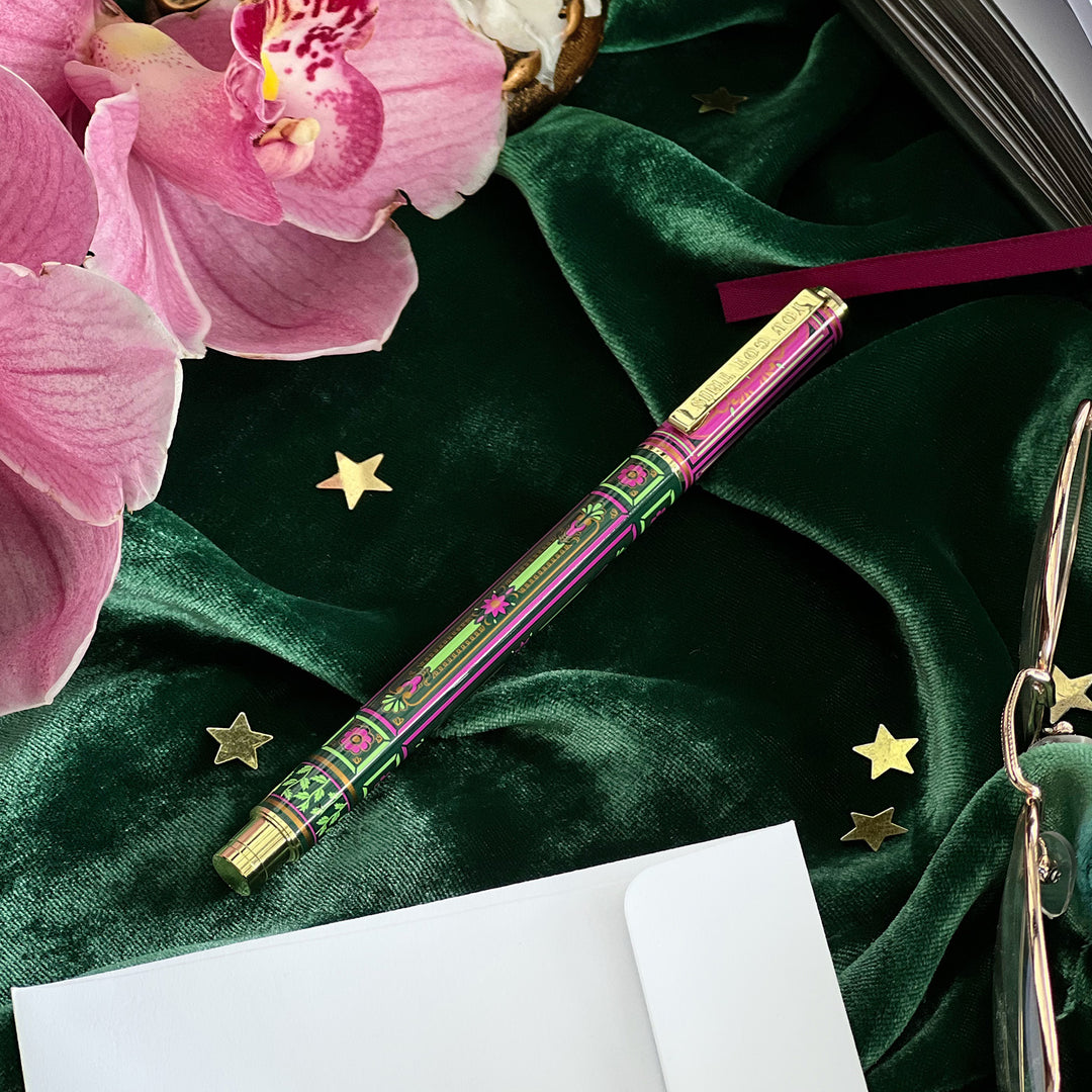 You got this gel pen- black ink- reading journal pen - green and purple - the quirky cup collective